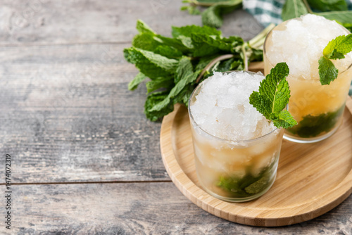 Classic Mint Julep Cocktail on wooden table. Copy space	