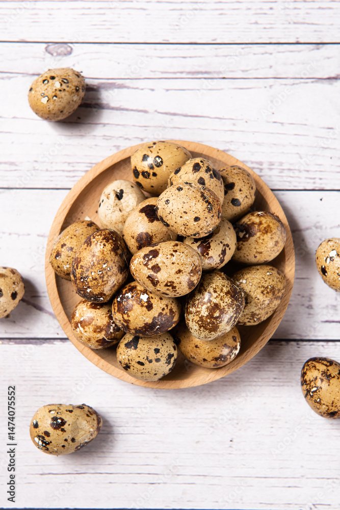 delicious quail eggs snack on wooden table.