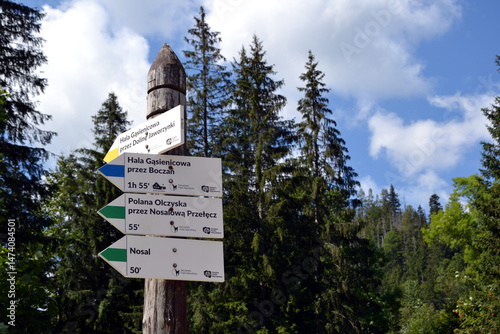 Tourist information board with tourist routes. Signpost on hiking trail. Route marking for tourists. Tatra mountains, Poland 