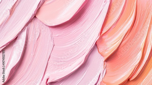 Colorful Abstract Swirls of Pink and Peach Paint on Canvas Creating a Textured Background Design