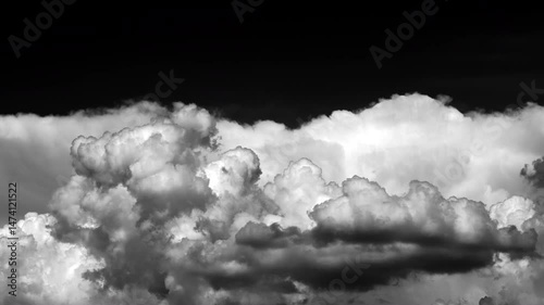 time-lapse of separate white clouds on a black background have real clouds. time-lapse of white fluffy cumulus cloud isolated