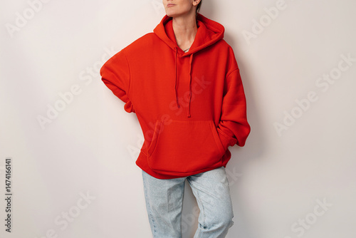 Person in Bright Oversized Hoodie Gesturing Playfully, Minimal and Neutral Aesthetic