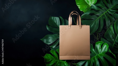 A brown paper bag with handles, placed on a dark background with green leaves in the background, suggesting a natural or eco-friendly theme.