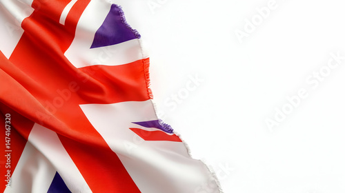A tattered Union Jack flag draped diagonally against a stark white background, leaving ample space