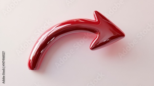 A glossy, red, curved object on a white background.