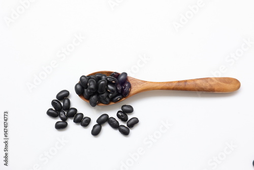 Fototapeta Naklejka Na Ścianę i Meble -  black beans soy on wooden spoon
