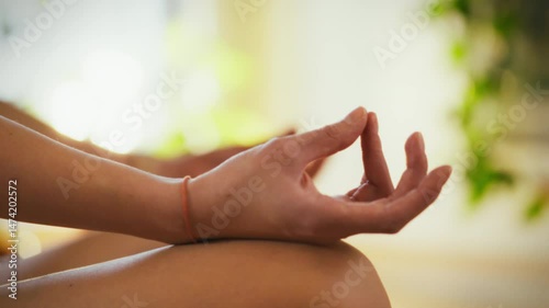 Wallpaper Mural Two hands rest in a meditative pose, representing tranquility and focus. The setting features soft natural light, suggesting a serene atmosphere for practicing mindfulness and relaxation Torontodigital.ca