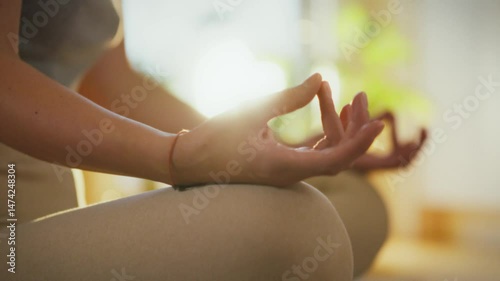 Wallpaper Mural Two individuals engage in meditation, sitting in a peaceful indoor space filled with natural light. Their focus on mindfulness creates a calming atmosphere, ideal for relaxation and reflection Torontodigital.ca