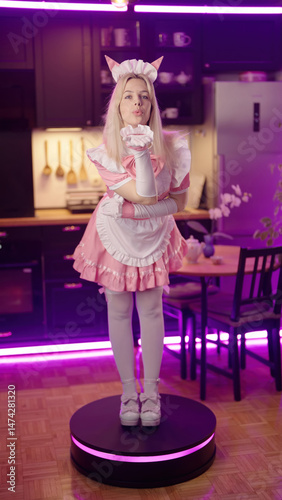 Anime cosplay girl pink maid figurine rotate on platform and send love kiss