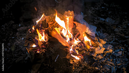 Burning Waste in a Dark Environment Illustrating Environmental Issues and Pollution