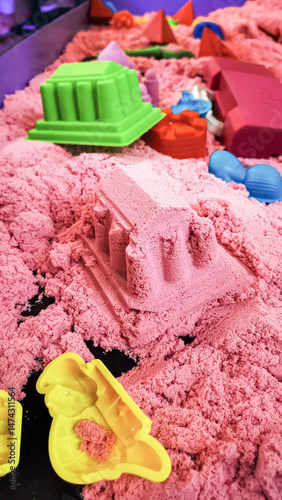 Kinetic sand playtime with colorful molds for endless creative possibilities