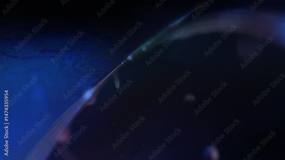 Green liquid edge on dark background, green Reflections of liquid in macro, green liquid surface, bubbles in macro, connection of bubbles in macro, cell from liquid, dark background, glossy surface
