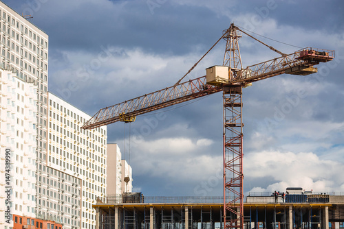 Construction tower crane on a sunny day. Construction of new residential areas. New buildings. Vidnoye, Leninsky district, Moscow region. photo