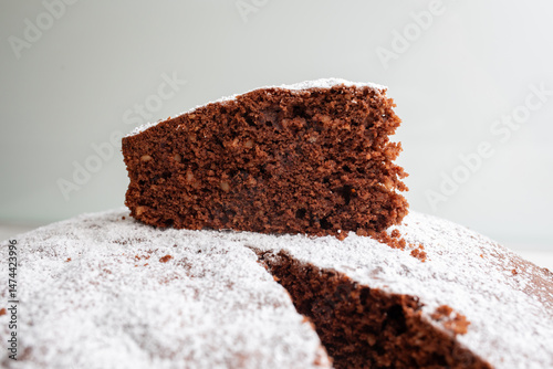 Quadro su tela Slice of delicious caprese cake resting on top of the rest of the cake