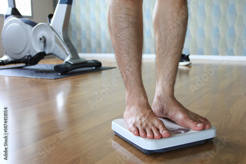 Male on the weight scale for check weight.Diet.Health and weight loss concept