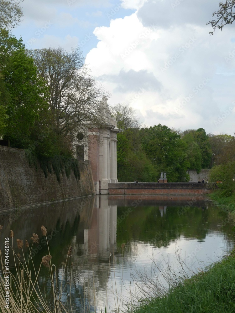 Fototapeta premium Ypres (Ieper), April 2025: Visit to the magnificent town of Ypres in Belgium - View of the ramparts of the Vauban fortication 