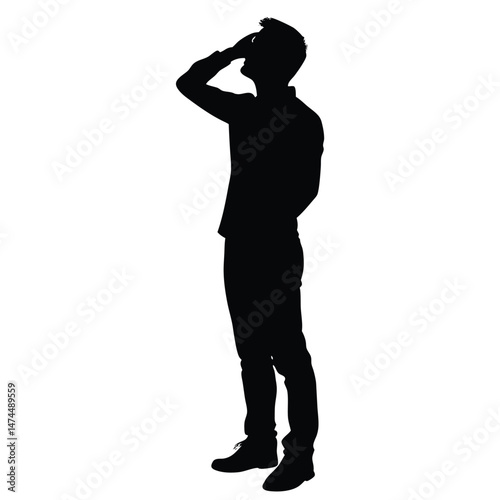 A silhouetted man is looking up with his hand on his forehead outside