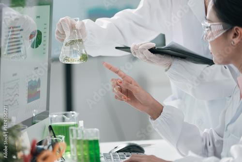 Scientists examining plant ...