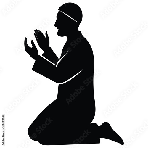 Silhouette captures an ethnic man wearing cap kneeling and raising hands in contemplation