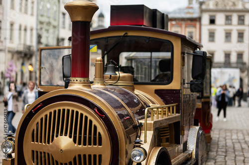 Fotografie Closeup of a decorative tourist train in a historic city square in Lviv, Ukraine