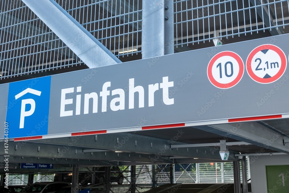 Naklejka premium Parking garage entrance sign with speed limit and height restriction displaying einfahrt