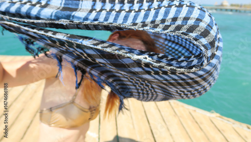 A young woman enjoys a sunn...