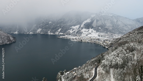 Wallpaper Mural Stunning winter scene of a town nestled beside a snow-covered lake and mountains. Perfect for travel and winter backgrounds. Torontodigital.ca