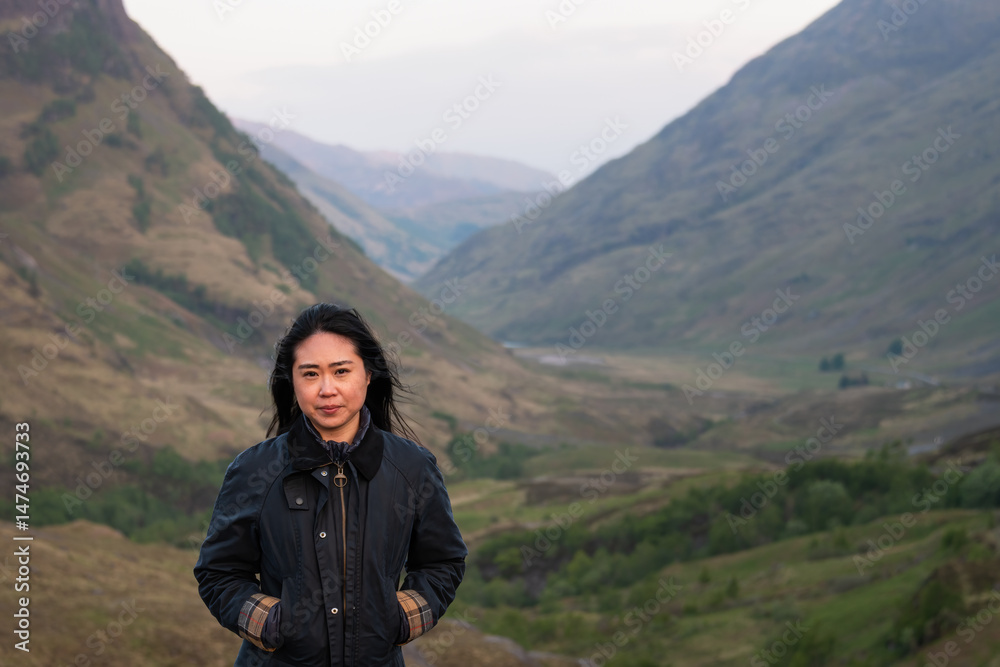 Fototapeta premium Woman in the mountains, glencoe, Scottish Highlands