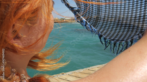 Redhead woman enjoys a bree...