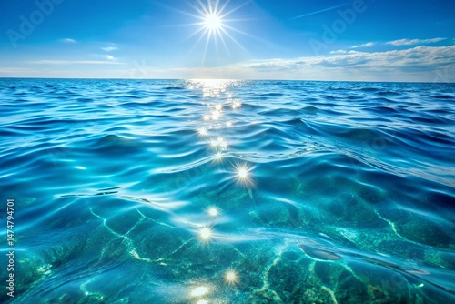 Shimmering Ocean Water Texture Sunlit Blue Sea Background photo