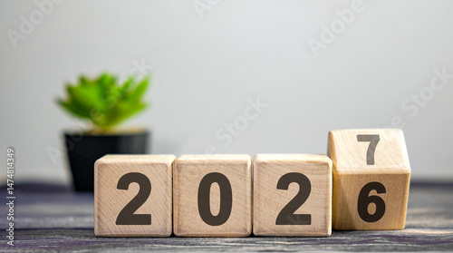 New year 2026 concept. Change of year 2026 to 2027, coup.