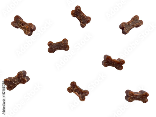 Dog bone treats scattered on white background, pet food concept