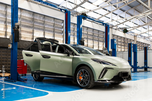 Modern Electric Car in Auto Repair Workshop