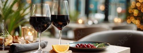 Enjoying Red Wine and Appetizers in a Cozy Restaurant Setting During Evening ...