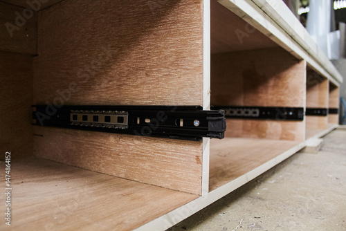 Obraz na plátně Explore the functionality of double extension drawer slides designed for furniture, particularly cabinets