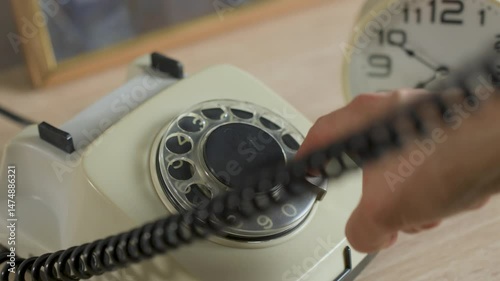 Hand Dialing a Vintage Rotary Telephone