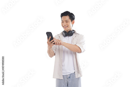 portrait of a young asian man standing posing on white background