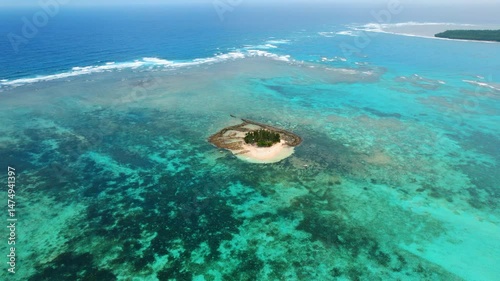 Stunning drone shot of Guyam Island with tropical Sandbar, Clear Blue Water, and Palm Trees photo
