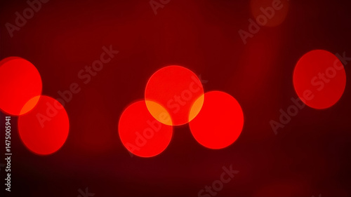 Red background with out of focus light circles and bokeh effect created using a macro lens, perfect for abstract, creative designs.

 photo