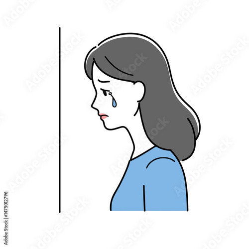 Sad woman with a tear looking to the side against a plain background  