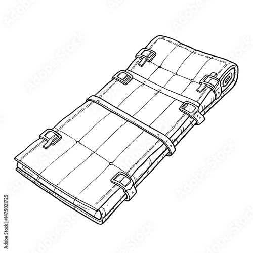 Rolled mat with straps and buckles, laid out diagonally, with quilted surface in black and white