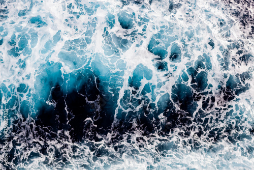 Water surface texture. Aerial view of enchanting water with foam. Can be used in covers, packaging, posters, textures, wallpapers, art, and design projects. Captivating vector illustration.