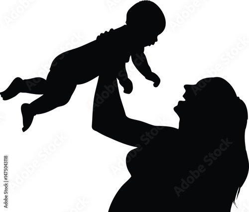 Silhouette of mother lifting baby in the air with love