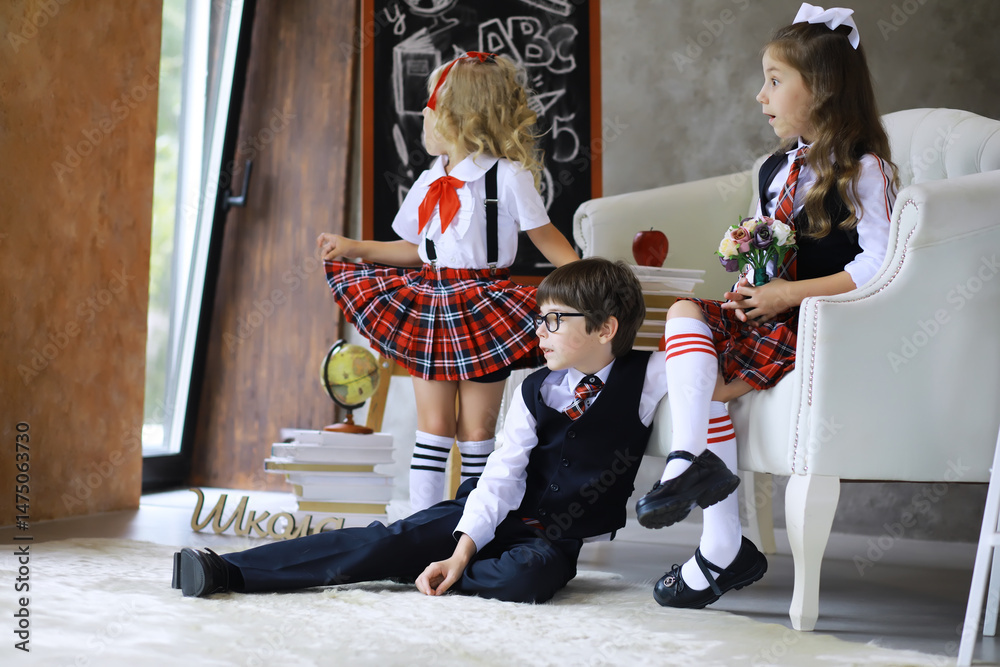Fototapeta premium Uniformed schoolchildren posing for the camera