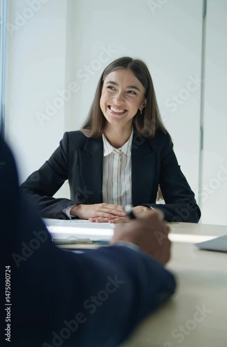 Businesswoman introducing herself with a smile in an interview for upgrading her career 