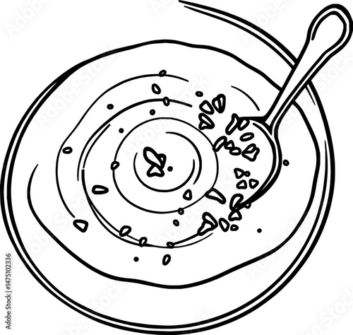 Overhead View of a Bowl of Creamy Soup with Spoon