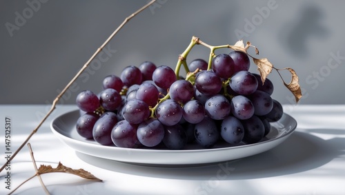 Wallpaper Mural Fresh black grape cluster with stem on white surface, isolated background Torontodigital.ca