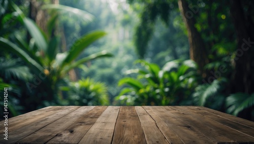 Indoor wooden table top with a blurry tropical forest background ideal for advertising and promotional displays photo