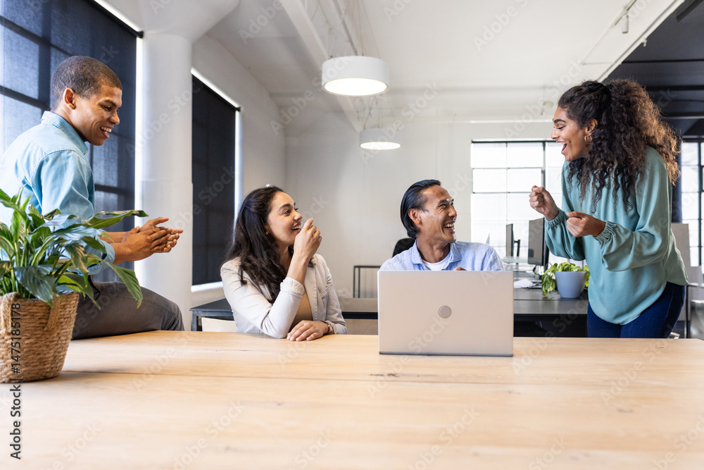 custom made wallpaper toronto digitalDiverse team collaborating and sharing ideas around laptop in modern office