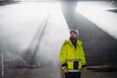 Portrait of construction foreman in modern building site.